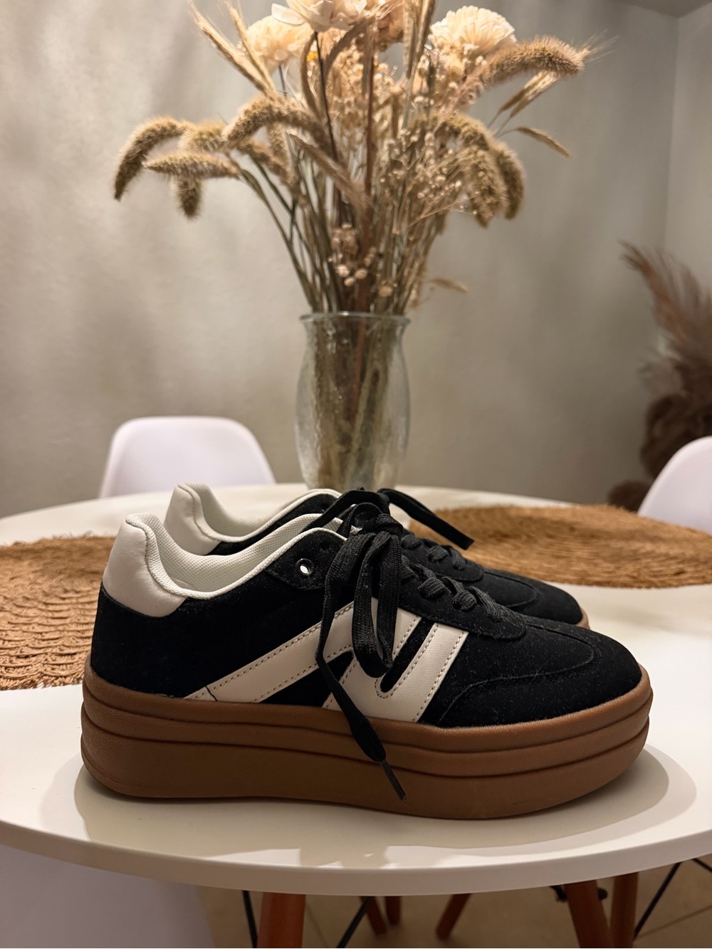Platform Lace-Up Sneakers in Black and White.